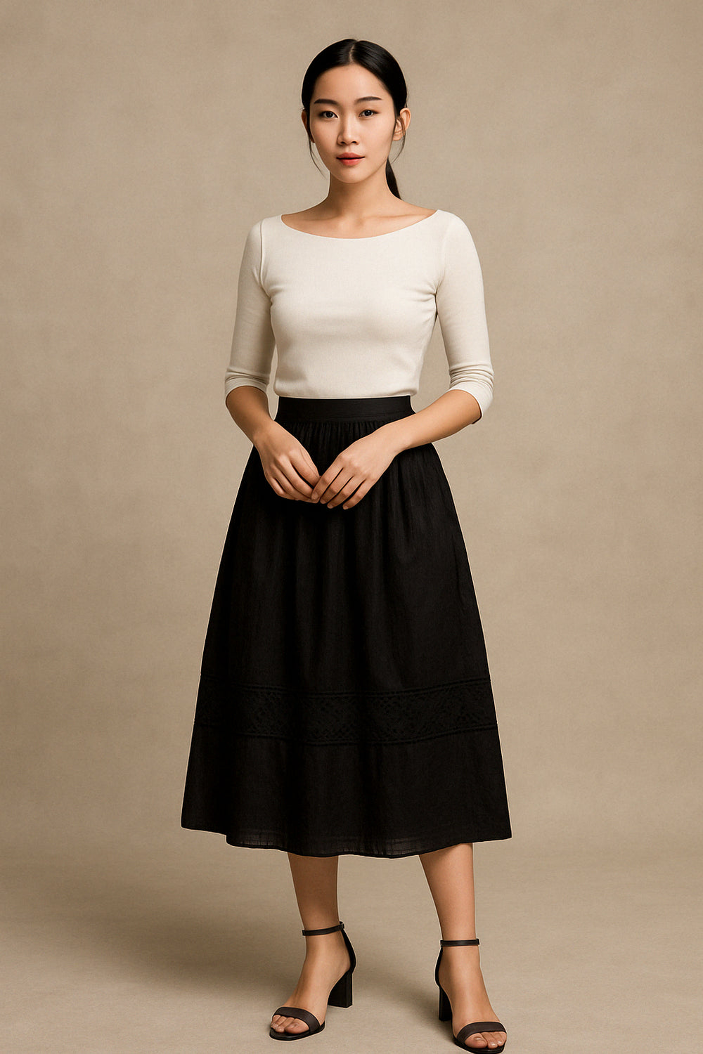 Jupe "Aṣọlẹ́" noire satin & broderie